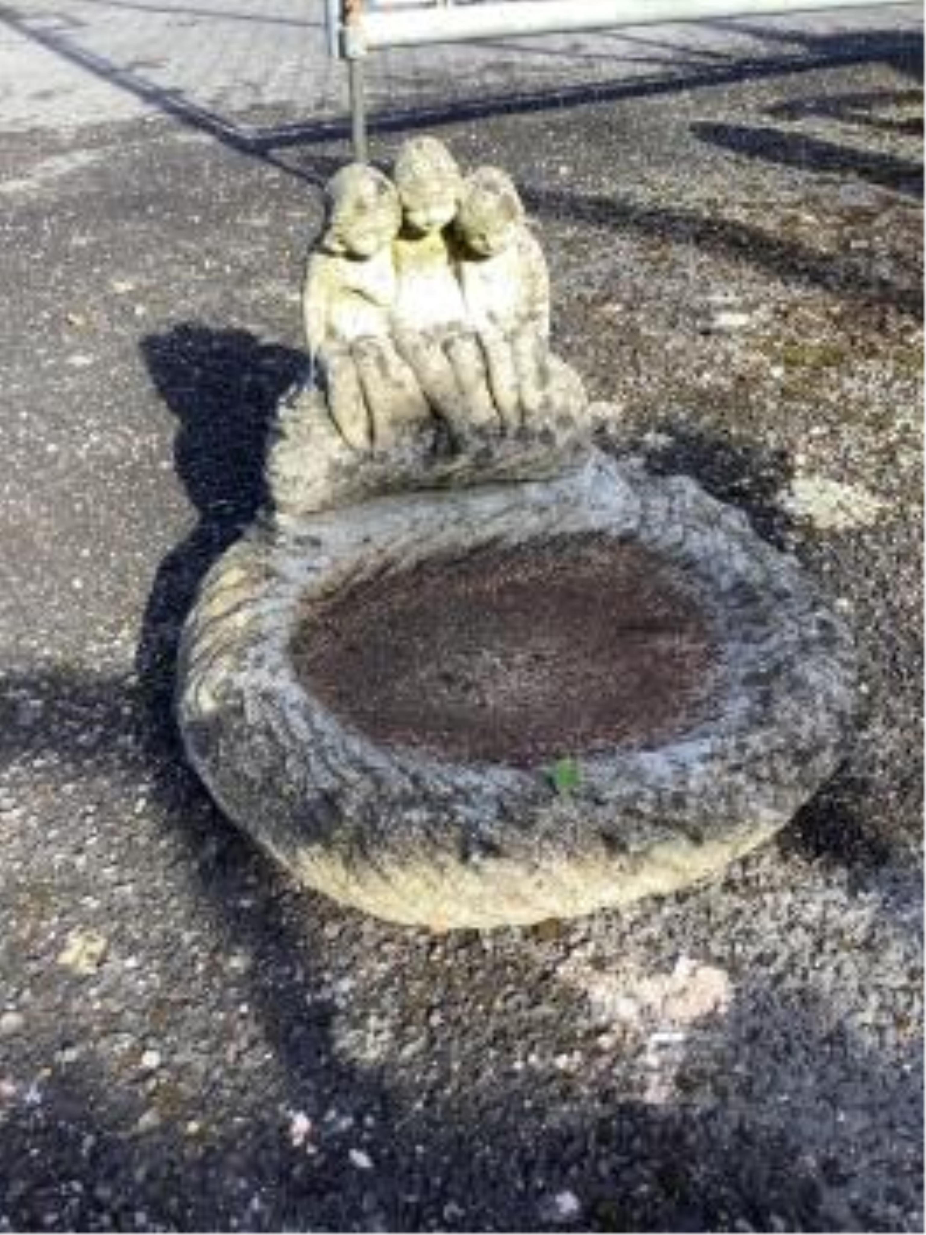 A Sparta Statues reconstituted stone pedestal bird bath, height 58cm, a more ornate larger bird bath, height 67cm and a reconstituted stone figural bird bath, width 46cm. Condition - pedestal bird baths fair to good, fig